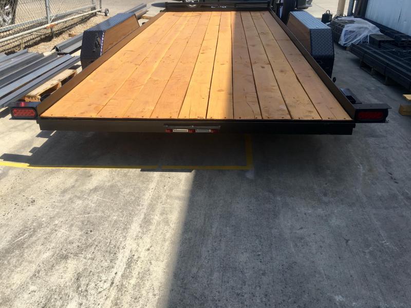 The wooden deck of a R & J Trailers Car / Racing Trailer.